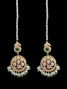 Gold plated earrings tika set light weight made using Cz stones shell pearls used earrings length -2.5 inches tika length 1.5 inches Green Kundan Bridal Earrings With Tilla, Traditional Tilla Chandelier Earrings For Wedding, Green Pearl Drop Danglers For Wedding, Green Kundan Bridal Earrings With Tilla Detail, Green Kundan Danglers With Stone Work, Green Chandbali Tikka With Stone Work, Green Kundan Hand-set Danglers, Traditional Tilla Metal Earrings, Pink Tilla Tikka Temple Jewelry