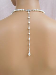 "Glamorous yet simple and elegant! I've created the Alyssa Jewelry pieces using Swarovski pearls and crystal component for a classic and elegant look. The beautifully detailed filigree clasp is custom designed by me. Backdrop measures 8\". If you want the backdrop longer or shorter, please message me! Alyssa Earrings measure 1.5\" (36mm) Front necklace drop measures 1.5\" (36mm) Shown with white/light ivory Swarovski pearls. Also available with cream or cream rose Swarovski pearls. Please state Elegant Single Strand Bridal Necklace For Wedding, Classic Bridal Necklace For Wedding, Formal Bridal Necklace With Pearl Chain And Crystal, Classic Pearl White Bridal Necklace For Wedding, Adjustable Single Strand Pearl Necklace For Wedding, Classic Crystal Pearl Necklace For Wedding, Classic Crystal Bridal Necklace For Wedding, Single Strand Pearl Necklace For Wedding, Classic Bridal Necklace With Pearl Pendant For Wedding