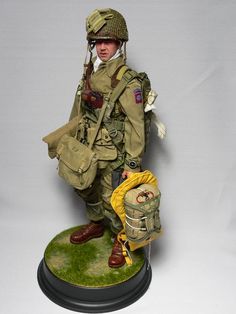 a figurine of a soldier holding a backpack