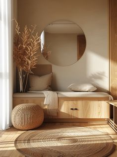 a round mirror sitting on top of a wooden shelf next to a bed in a bedroom