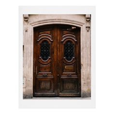 an old wooden door with two glass panes