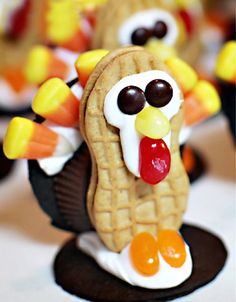 a cookie shaped like a turkey with candy eyes