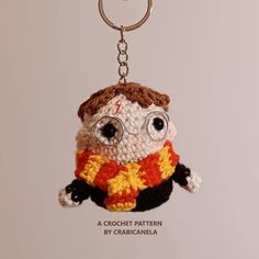 a crocheted harry potter keychain with glasses