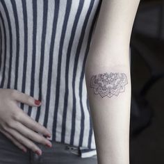 a woman's arm with a tattoo on it and the words inspiridtatios