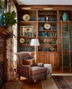 a living room filled with furniture and bookshelves