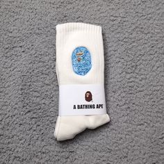 A Bathing Ape Crew Socks Embroidered Ape Head Logo Mens Womens Unisex Size: One Size Fits All Color: Cream White Blue Camo Brand New In Packaging. Fast Shipping! 1 Day Shipping And Handling. Blue Bape Shoes, Bape Socks, Bape Accessories, The Bathing Ape, Bathing Ape Shirt, Dream Items, Wallpapers Cartoon, Unusual Clothes, Brand Ideas