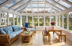 Bright Sunroom woth Bamboo Furniture and Blue Patterned Cushions There is a bamboo sofa set and a wooden dining table in the sunroom, which has an area in a square form. Sunroom Window Ideas, Marthas Vineyard Interior Design, Small Bar Areas, Martha Vineyard, Open Gazebo, Veranda Design, Large Gazebo, Hot Tub Gazebo, Sunroom Furniture