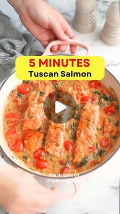 someone is cooking in a pan with tomatoes and spinach on the side, which reads 5 minutes tuscan salmon