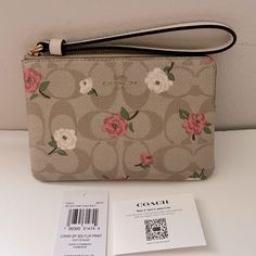 New Coach Corner Zip Wristlet In Signature Canvas With Floral Print Cr973 $88 Signature Coated Canvas And Recycled Leather Two Credit Card Slots Zip-Top Closure, Fabric Lining Wrist Strap Attached 6 1/4" (L) X 4" (H) X 1/2" (W) Style No. Cr973 Elegant Rectangular Wristlet For Spring, Elegant Rectangular Spring Wristlet, Elegant Spring Rectangular Wristlet, Beige Clutch With Wrist Strap For Gift, Beige Clutch With Wrist Strap As Gift, Wristlet With Removable Pouch As Gift, Elegant Wristlet For Spring, Beige Rectangular Wristlet For Spring, Rectangular Beige Wristlet For Spring