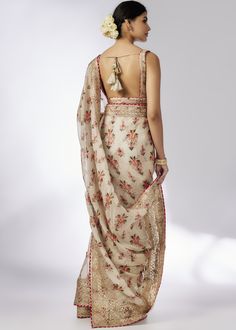 A delicate, floral jaal, layered frill saree with flounce, flow and intricate embroidered border is a easy wrap, the classic sleeveless printed blouse adds glamour and glitz to the ensemble. Elegant Floral Print Pre-draped Saree For Designer Wear, Elegant Floral Print Lehenga With Traditional Drape, Elegant Lehenga Saree With Floral Print, Elegant Saree With Floral Print For Reception, Elegant Silk Pre-draped Saree With Floral Print, Elegant Floral Print Pre-draped Saree For Diwali, Elegant Floral Print Pre-draped Saree For Reception, Elegant Floral Pre-draped Saree For Diwali, Elegant Floral Pre-draped Saree For Reception