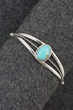 This turquoise and sterling silver bracelet was made by Navajo silversmith Alice Rose Saunders.Size: 5 1/8" (will fit up to a 6 1/2" wrist)Gap: 1 3/8"Width: 5/8"Cuff Width: 1/4"Free shipping on all orders! We ship with USPS and always include tracking. All orders ship within a day of payment.Returns are accepted up to 30 days after you receive your order. Just send us a message. Our shop offers cash back or store credit. The item must be returned in new condition. Southwestern Style Sterling Silver Bracelet, Alice Rose, Sterling Silver Bracelet, Turquoise Sterling Silver, Sterling Silver Bracelets, Happy Valentines Day, Happy Valentine, Silver Bracelet, Gap