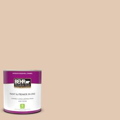 a can of behr paint on a pink background