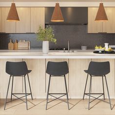 three bar stools in front of a kitchen island