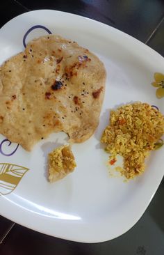 a white plate topped with food on top of a table