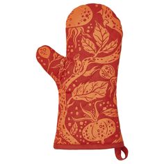 an oven mitt with red and orange designs on it