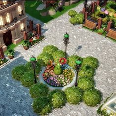 an aerial view of a small garden in the middle of a courtyard with flowers and trees