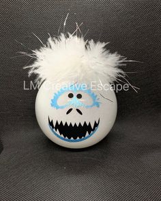 "Abominable snowman inspired shatterproof plastic round glitter ornament ball. Glitter is on the inside of the ornament. Glitter will not get all over your house. Ornament is approximately 3.25\" in diameter. Each ornament is hand made and therefore may look slightly different than the one in the photo. Colors on your screen may appear different than in person. I try to show the colors as accurately as possible." Yeti Snowman, Snowman Outdoor Decorations, Light Bulb Ornaments, Abominable Snowman, Glitter Ornaments, Grade 6, Snowman Ornaments, Christmas Stuff, Babies First Christmas