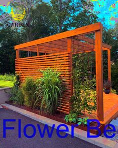 a wooden structure with plants growing in it and the words flower bed above it that says,