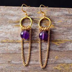 These Delicate Tassels Gothic Earrings exude elegance with their intricate beadwork and luxurious tassel detail. Add a touch of sophistication to your look with these stylish statement pieces. Material: Jade, Emperor jasper, Amethyst, Stainless steel Plating: Gold-plating Size: Around 6 cm Product condition: 100% New and Exquisite Quality. Returns: Money back guarantee (30 days free return) About Shipping: Your item will typically arrive in 7-14 days. Return Policy Contact us Elegant Latkans Earrings, Elegant Latkan Earrings With Round Beads, Elegant Tassel Earrings With Round Dangling Beads, Elegant Purple Tassel Earrings, Handmade Elegant Purple Tassel Earrings, Elegant Handmade Purple Tassel Earrings, Elegant Purple Tassel Earrings For Party, Purple Dangle Tassel Jewelry, Purple Dangle Jewelry With Tassels