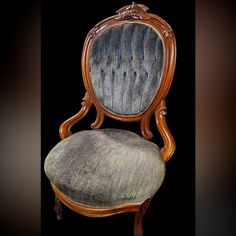 an antique chair is upholstered with wood and fabric, while the seat has been stripped off