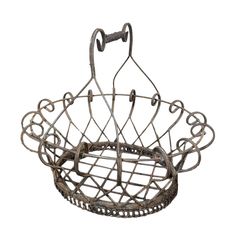 an old metal basket hanging from a hook on a white background with clippings