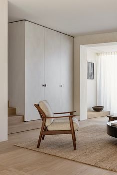 a living room with a couch, chair and coffee table