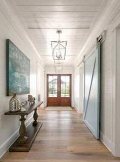 the hallway is clean and ready to be used for decoration or as an entrance way