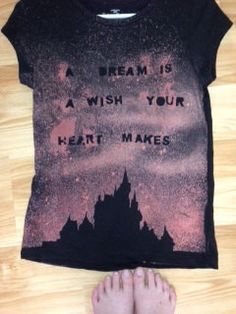 a person standing next to a t - shirt that says, a dream is a wish your heart makes