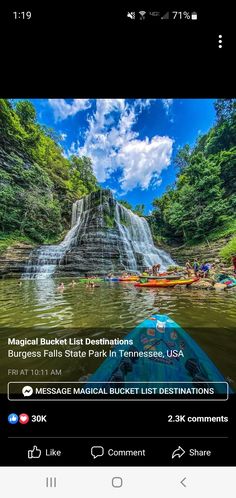 an image of a boat in the water near a waterfall with people floating on it