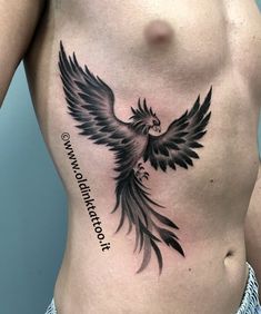 a man's chest with an eagle tattoo on it