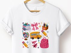 Back to School Coquette Shirt, School Bus Shirt, Back to School Sublimation Design, First Day Of School, Teacher Gift,Kindergarten,Preschool ------------------------------------------ 👕 Welcome to byTDG! 👕 💖 TDG wishes you a pleasant shopping experience. 👕  We are here to offer you the most suitable shirt options. We want to make everyone smile with our cute, stylish and trendy graphic t-shirts. We can assume that this shirt will be the perfect gift for yourself or someone else.   Be sure to Pink T-shirt For Back To School, Casual School Shirt With Sublimation Print, White Tops For Teacher Appreciation Back To School, Cute School Shirt With Crew Neck, White School Spirit Shirt For School, Playful Multicolor Shirt For School, White School Spirit Shirt, Playful Crew Neck School Shirt, Playful Graphic Print Tops For School Events