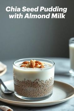 chia seed pudding with almond milk in a glass bowl on a plate next to a spoon