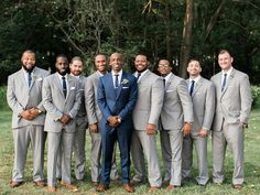 a group of men in suits standing next to each other