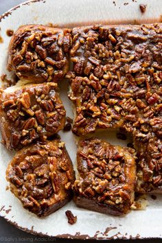 slices of pecan pie on top of a white plate with pecans in the middle