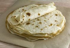 four tortillas stacked on top of each other