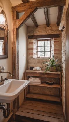 a bathroom with a sink, mirror and wooden steps leading up to the toilet area