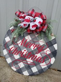 a wooden sign that says merry christmas on it