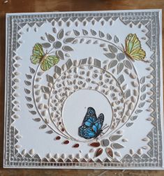 a white card with blue butterflies on it