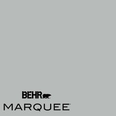 an airplane is flying in the sky over marquee logo on a gray background