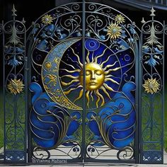 an iron gate with a sun and moon on it