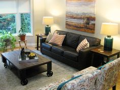 a living room filled with furniture and lamps