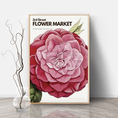 a flower market poster on the wall next to a vase