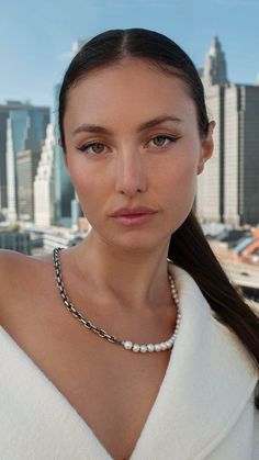 Woman wearing necklace with a chain and pearls. Pearl Chain Necklace, Silver Pearl Necklace, Pearls Necklace