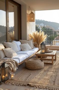 a living room filled with furniture and lots of windows