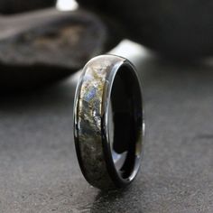 a wedding ring with an antler wood inlay and black plated metal inside