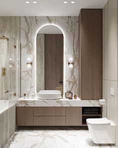 a bathroom with marble walls and flooring is shown in this image, there are lights on the mirror above the sink