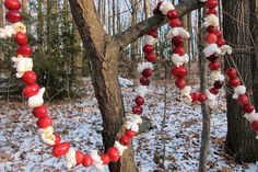 a tree decorated with candy and marshmallows in the winter forest, ready to be eaten