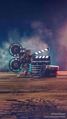 a movie projector sitting on top of a wooden table