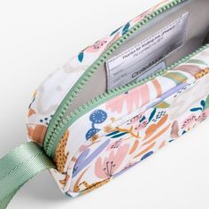 A fun pencil case that's built to handle all the thrills of a day in the wild. Big cats, blooms and a lush landscape decorate the bag's bright white exterior, and a contrasting green zipper, zipper pull and loop handle give it the perfect finish. Constructed of supremely durable polyester fabric that includes recycled plastic bottles, our roomy, easy-clean case makes it simple to keep all their pens and pencils organized and accessible. Pair with the Leopard Floral lunch box and matching backpac Pencil Case Photography, Green Travel Pencil Case, Green Portable Pencil Case For Travel, Portable Green Pencil Case For Travel, Travel Multicolor Zipper Pouch Pencil Case, Multicolor Zipper Pouch Pencil Case For Travel, Green Zipper Pouch Pencil Case, Green Rectangular Pencil Case With Zipper, Green Rectangular Zipper Pencil Case