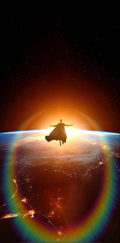 a person flying through the air with a rainbow in front of them and an earth background